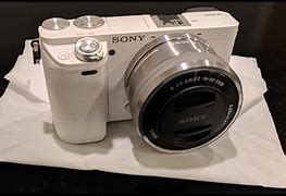 Image result for White Sony Camera