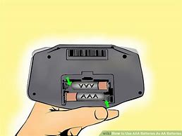 Image result for How to Put AA Batteries in Photo T