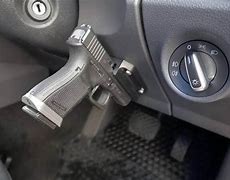 Image result for Gun On Car Door Holster
