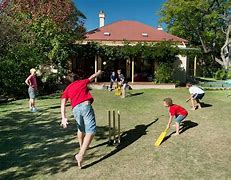 Image result for Back Yard Cricket Game with Oil Cans