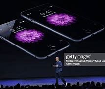 Image result for White iPhone of Tim Cook
