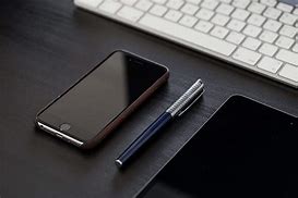 Image result for Black iPhone On Table