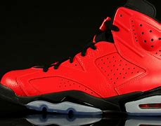 Image result for Orange and Black Jordan 6s