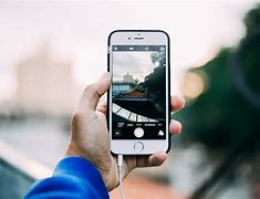 Image result for Someone Holding a Small iPhone