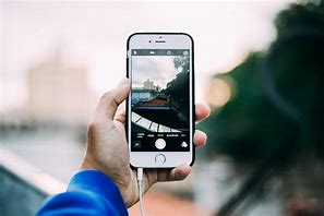 Image result for Person Taking a Photo Using an iPhone