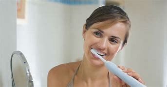 Image result for Using Electric Toothbrush