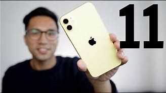 Image result for Holding iPhone 11 Yellow