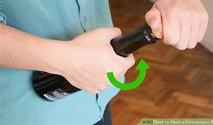 Image result for How to Open a Champagne Bottle