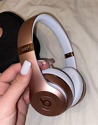 Image result for Beats Solo3 Rose Gold Working Out