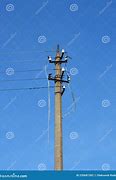 Image result for Broken Power Pole Held Together with Rope Near Sand