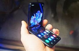 Image result for Samsung Flip Phone with Rotating Camera