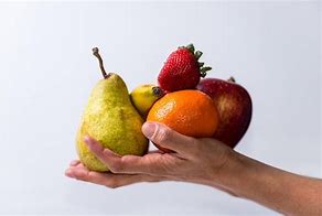 Image result for Hand Hlding Fruit