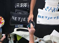 Image result for Famous Golf Players with the NetJets Logo