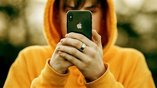 Image result for Man Holding Red iPhone