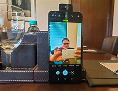 Image result for Sharp Phone with 3 Camera