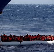 Image result for African Migrants Caught in Tail Fin Ship