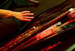 Image result for A Girl Playing Indian Flute