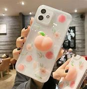 Image result for iPhone 14 Pro Gold with Peach Case