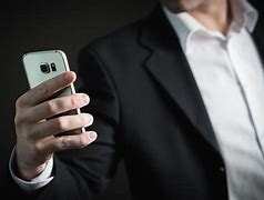 Image result for People Holding Up Cell Phones