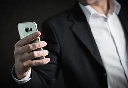 Image result for Person Holding a Cell Phone