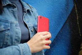 Image result for Girl Holding iPhone in Hand with Green Background