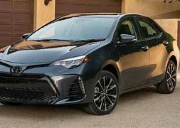 Image result for Toyota Corolla 2017 Black in a Dealership