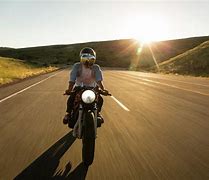 Image result for A Man Riding a Motorcycle