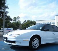 Image result for white saturn car