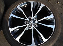 Image result for 2016 White Toyota Corolla Blue Rims