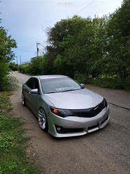 Image result for Lowered Camry with Red Wheels