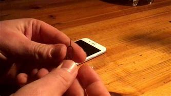 Image result for How to Pull Out Sim Tray iPhone 6s