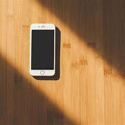 Image result for White iPhone 5 On Table