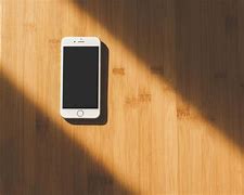 Image result for Phone Laying On Tabke