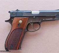 Image result for Old Smith and Wesson 9Mm