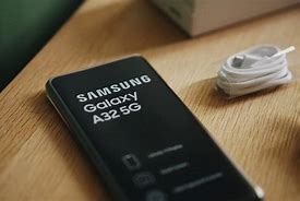 Image result for Someone Holding a Samsung A32 5G