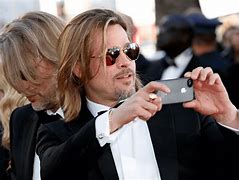 Image result for Famous Person Holding iPhone