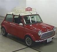 Image result for Funny Mini Cooper with Item On Roof