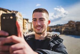 Image result for Man Taking Picture with Cell Phone