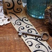 Image result for Burlap Ribbon with Black Scroll