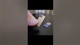 Image result for Smallest iPhone in the World with Smallest Charger in the World Image Pink