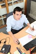 Image result for Young Man Working in Office