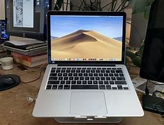Image result for Apple MacBook Pro Mid Silver Size