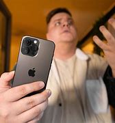 Image result for Holding iPhone 14