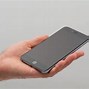 Image result for Holding iPhone 6 Plus Size