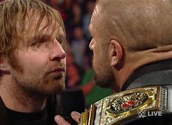 Image result for Dean Ambrose Grabs Triple H Nose