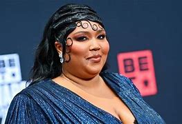 Image result for Lizzo Holding Up a Kid