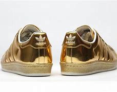 Image result for Adidas Dame 8 Maroon Gold