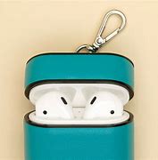 Image result for Air Pods While Charging the Case with Light