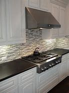 Image result for Glass Backsplash Tile and Black Green Gold Granite Countertop Ideas
