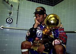 Image result for LeBron Holding Trophy Like. Kobe